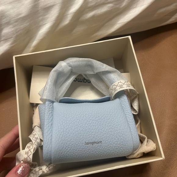 Songmont Handbags - Songmont Light Blue mini Song airpods case Bag